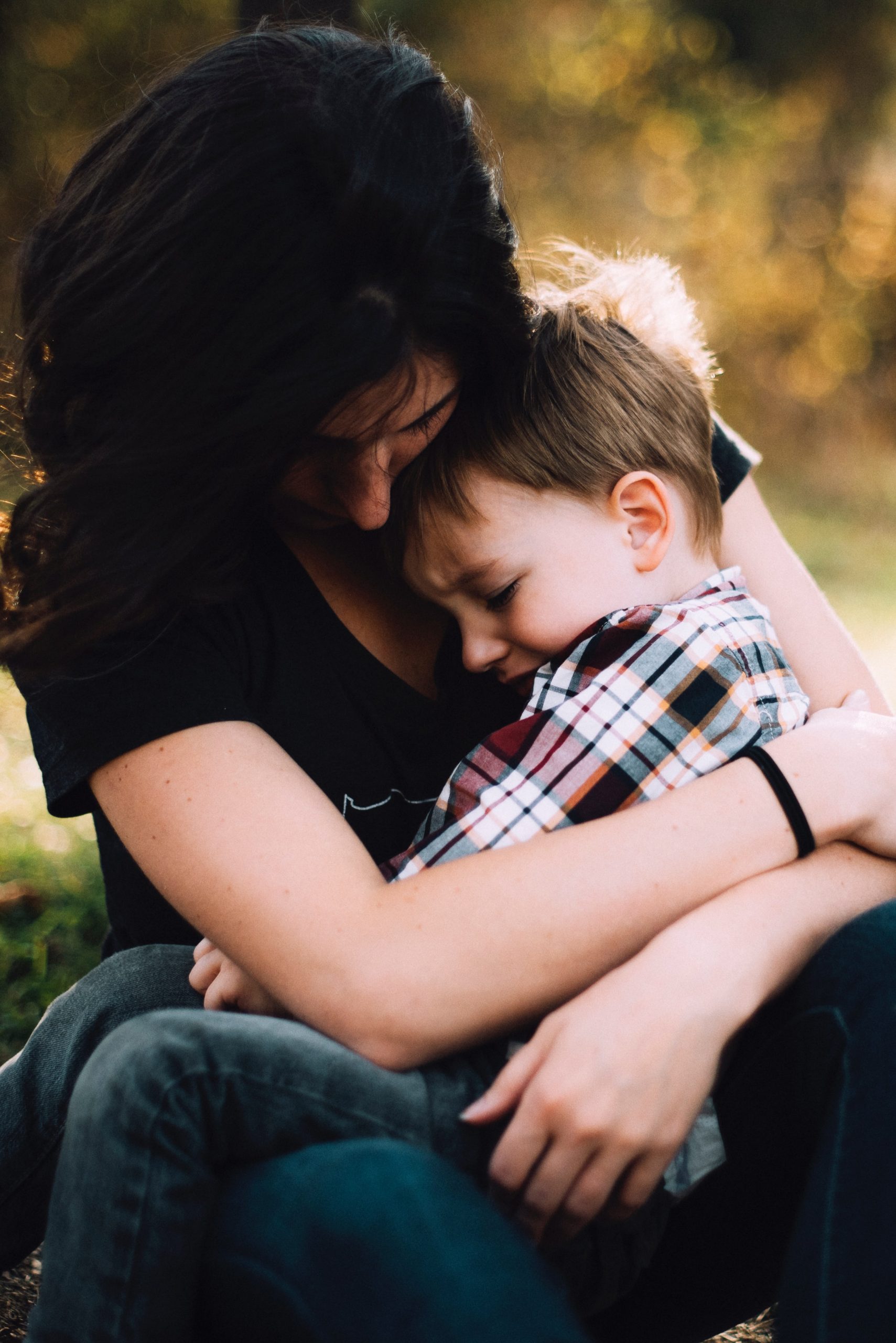 woman embracing child